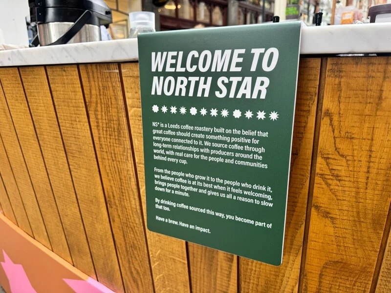 An image of the green "Welcome to North Star" counter signage.